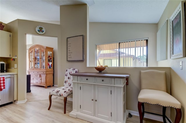 612 Fairmont Ave Unit D, Safety Harbor, FL 34695 - interior space with light wood-style flooring, stainless steel dishwasher, baseboards, and lofted ceiling