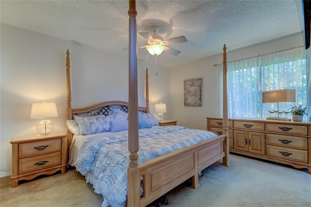 612 Fairmont Ave Unit D, Safety Harbor, FL 34695 - bedroom with light carpet, a ceiling fan, and a textured ceiling