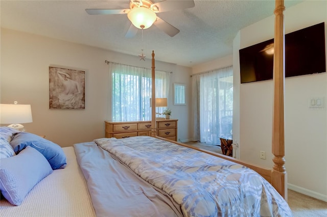 612 Fairmont Ave Unit D, Safety Harbor, FL 34695 - bedroom with ceiling fan, a textured ceiling, light colored carpet, and baseboards