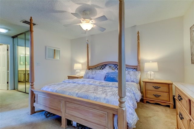 612 Fairmont Ave Unit D, Safety Harbor, FL 34695 - bedroom with visible vents, a ceiling fan, light carpet, and a textured ceiling