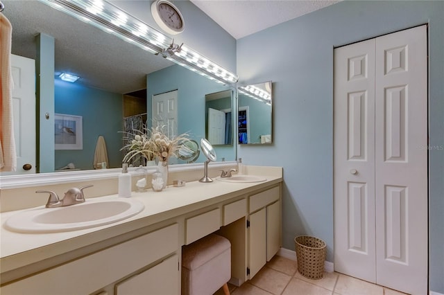 612 Fairmont Ave Unit D, Safety Harbor, FL 34695 - full bath with a closet, double vanity, a sink, and tile patterned flooring