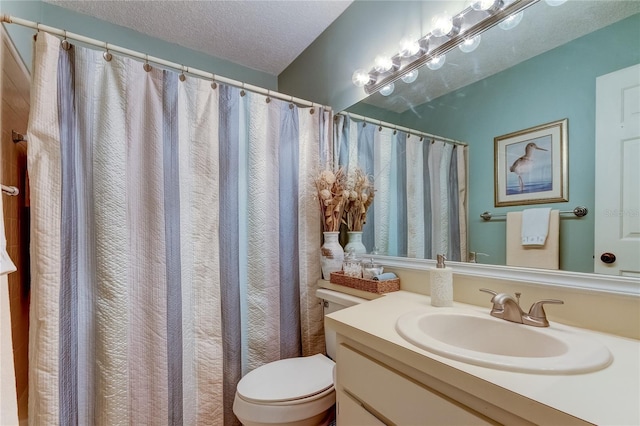 612 Fairmont Ave Unit D, Safety Harbor, FL 34695 - bathroom featuring vanity, a textured ceiling, and toilet