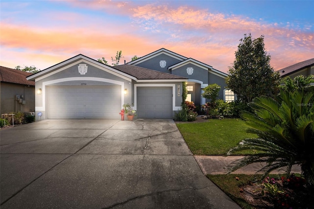 19750 Ellendale Dr, Land O Lakes, FL 34638 - single story home featuring stucco siding, a garage, concrete driveway, and a yard