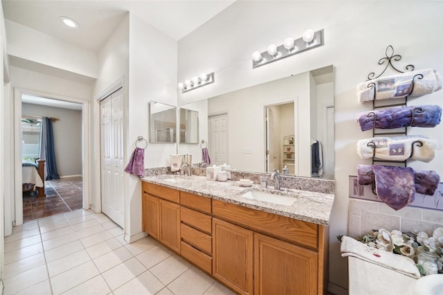 19750 Ellendale Dr, Land O Lakes, FL 34638 - bathroom with double vanity and tile patterned floors