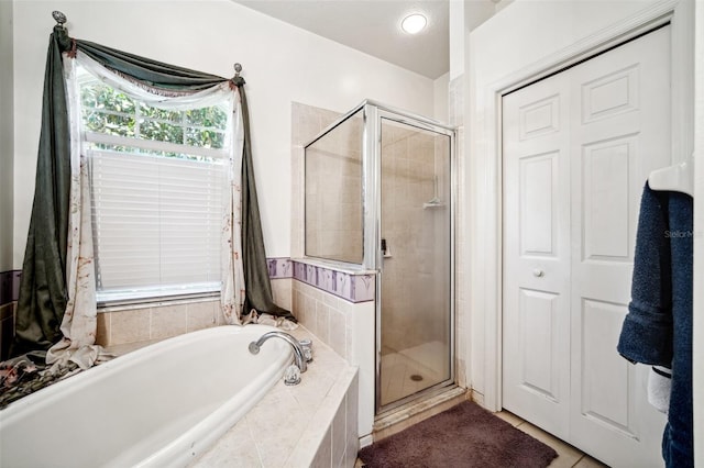 19750 Ellendale Dr, Land O Lakes, FL 34638 - full bath with a bath, a shower stall, and tile patterned floors