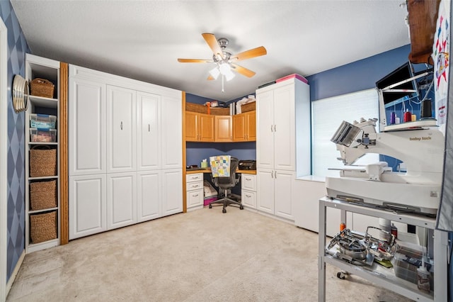 19750 Ellendale Dr, Land O Lakes, FL 34638 - home office featuring light carpet, built in desk, and a ceiling fan