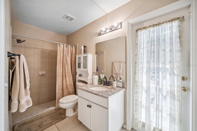 19750 Ellendale Dr, Land O Lakes, FL 34638 - full bathroom featuring vanity, tile patterned floors, and tiled shower