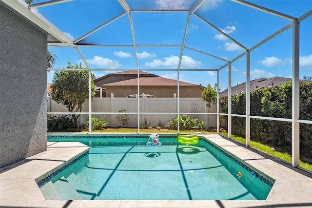 19750 Ellendale Dr, Land O Lakes, FL 34638 - swimming pool featuring a fenced backyard and glass enclosure