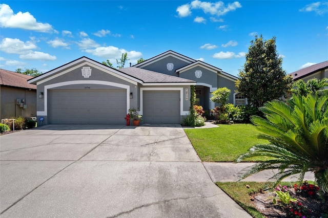 19750 Ellendale Dr, Land O Lakes, FL 34638 - ranch-style home featuring stucco siding, an attached garage, concrete driveway, and a front lawn