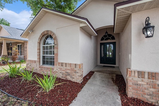 6711 Thackston Dr, Riverview, FL 33578 - entrance to property featuring stucco siding and brick siding