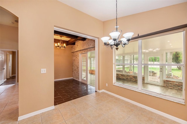 6711 Thackston Dr, Riverview, FL 33578 - tiled spare room featuring a chandelier, beam ceiling, baseboards, and arched walkways