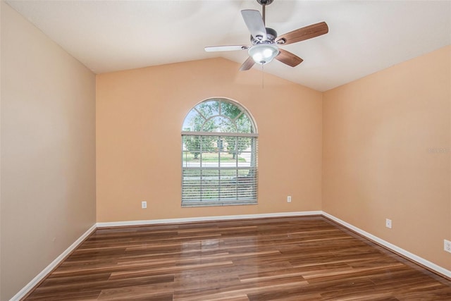 6711 Thackston Dr, Riverview, FL 33578 - spare room with wood finished floors, a ceiling fan, vaulted ceiling, and baseboards