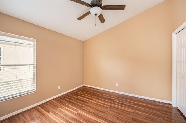 6711 Thackston Dr, Riverview, FL 33578 - spare room with healthy amount of natural light, wood finished floors, a ceiling fan, baseboards, and lofted ceiling