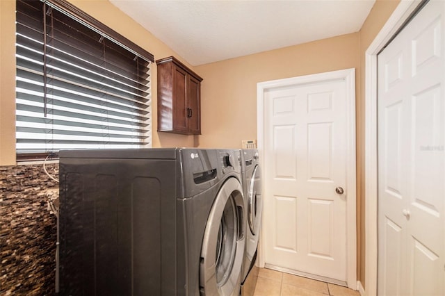 6711 Thackston Dr, Riverview, FL 33578 - washroom with independent washer and dryer, light tile patterned flooring, and cabinet space