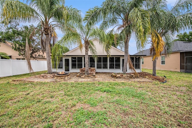 6711 Thackston Dr, Riverview, FL 33578 - rear view of property featuring a sunroom and a fire pit