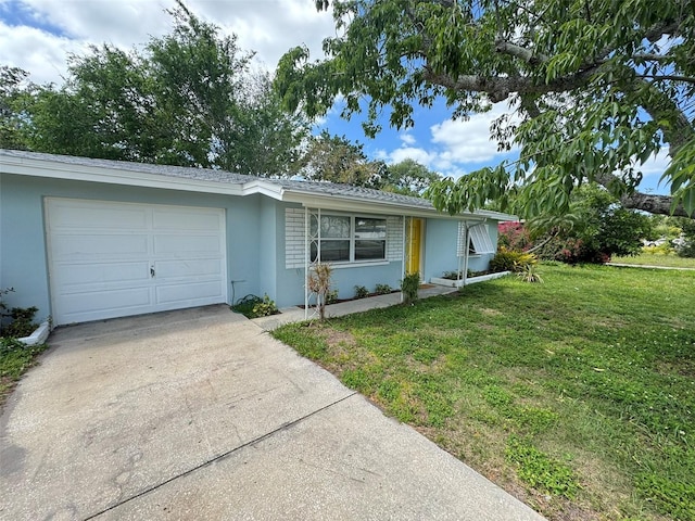 ranch-style home with a front yard, an attached garage, driveway, and stucco siding