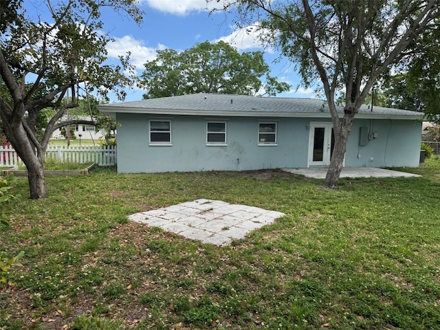 back of property with a patio area, stucco siding, and fence
