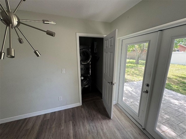 doorway to outside with baseboards and wood finished floors