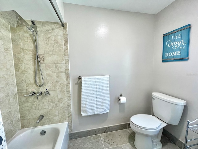 bathroom with toilet, shower / bathtub combination, and baseboards
