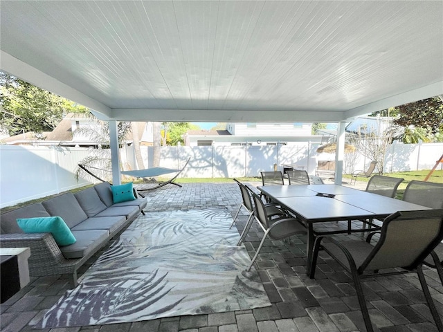 view of patio / terrace featuring outdoor lounge area, outdoor dining area, and a fenced backyard