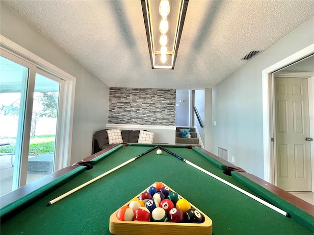 recreation room with a textured ceiling, visible vents, and pool table