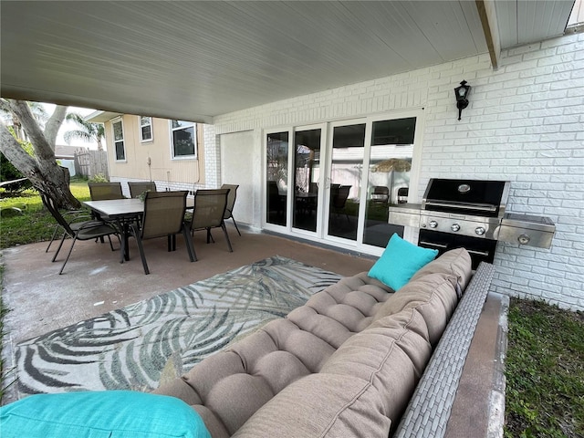 view of patio / terrace with outdoor lounge area, outdoor dining area, and area for grilling