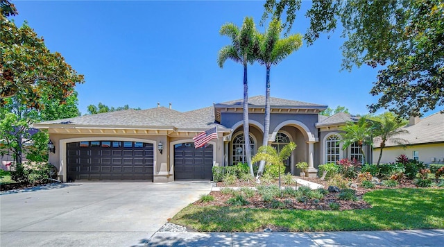 3212 Sunset Lakes Blvd, Land O Lakes, FL 34638 - mediterranean / spanish house featuring stucco siding, a garage, and driveway