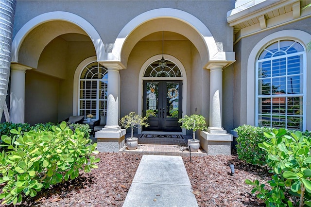 3212 Sunset Lakes Blvd, Land O Lakes, FL 34638 - property entrance with french doors and stucco siding