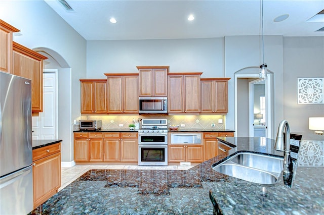 3212 Sunset Lakes Blvd, Land O Lakes, FL 34638 - kitchen with appliances with stainless steel finishes, a sink, a warming drawer, decorative backsplash, and recessed lighting