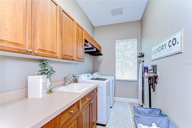3212 Sunset Lakes Blvd, Land O Lakes, FL 34638 - washroom featuring cabinet space, washer and clothes dryer, baseboards, and light tile patterned floors