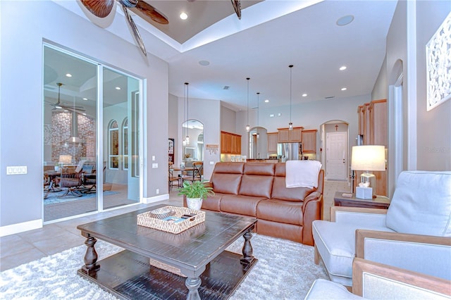 3212 Sunset Lakes Blvd, Land O Lakes, FL 34638 - living area with arched walkways, a ceiling fan, vaulted ceiling, baseboards, and recessed lighting
