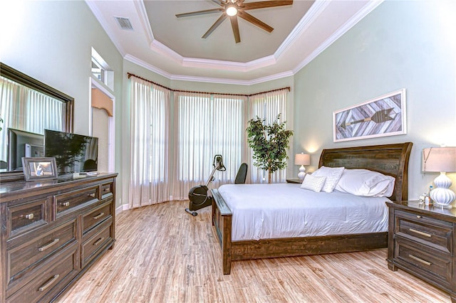 3212 Sunset Lakes Blvd, Land O Lakes, FL 34638 - bedroom with a tray ceiling, light wood-style flooring, crown molding, and a ceiling fan