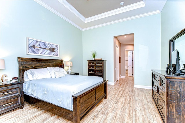 3212 Sunset Lakes Blvd, Land O Lakes, FL 34638 - bedroom with light wood-type flooring, baseboards, ornamental molding, and a raised ceiling
