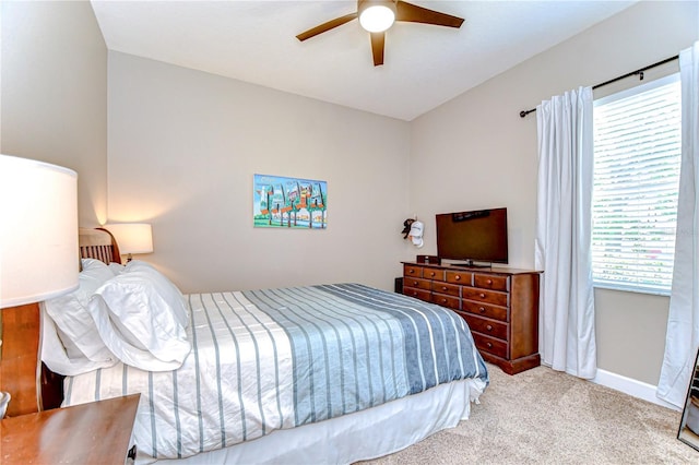 3212 Sunset Lakes Blvd, Land O Lakes, FL 34638 - bedroom featuring multiple windows, light carpet, baseboards, and a ceiling fan