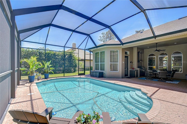 3212 Sunset Lakes Blvd, Land O Lakes, FL 34638 - swimming pool featuring a patio, a ceiling fan, outdoor dining space, and glass enclosure