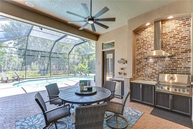 3212 Sunset Lakes Blvd, Land O Lakes, FL 34638 - view of patio / terrace with an outdoor kitchen, grilling area, a ceiling fan, an outdoor pool, and a lanai