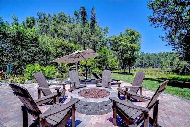 3212 Sunset Lakes Blvd, Land O Lakes, FL 34638 - view of patio featuring an outdoor fire pit