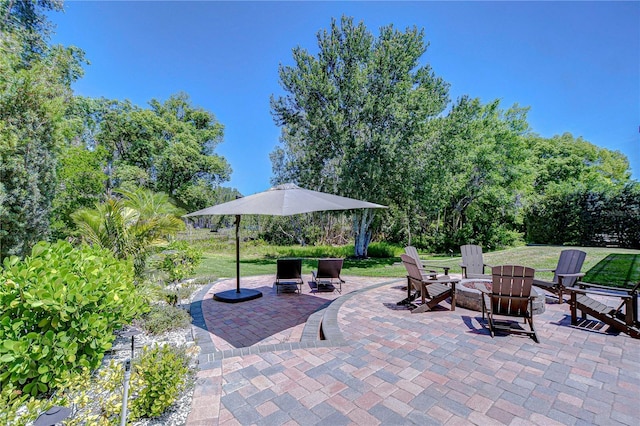 3212 Sunset Lakes Blvd, Land O Lakes, FL 34638 - view of patio featuring a fire pit