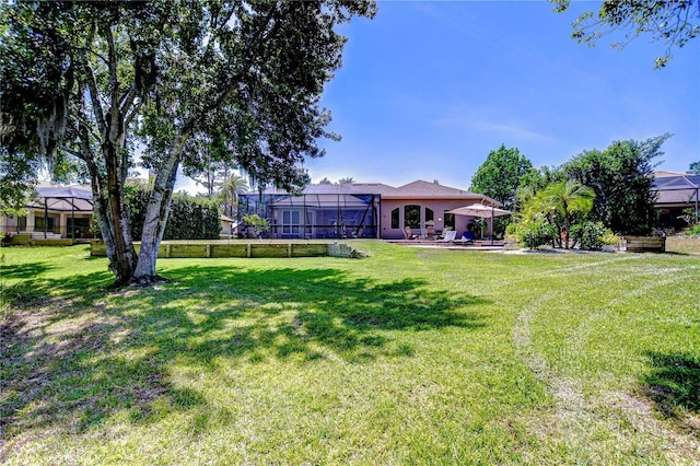 3212 Sunset Lakes Blvd, Land O Lakes, FL 34638 - view of green lawn with a gazebo and a lanai
