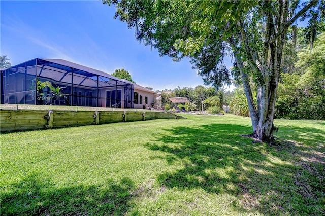 3212 Sunset Lakes Blvd, Land O Lakes, FL 34638 - view of grassy yard featuring a lanai