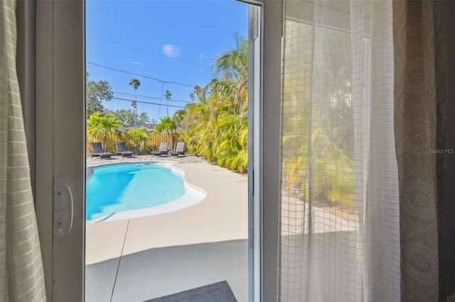 view of swimming pool featuring a fenced in pool, a patio area, and a fenced backyard