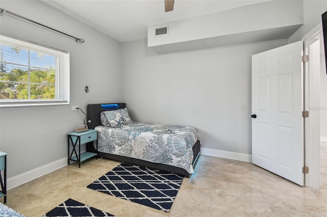 bedroom featuring visible vents, baseboards, and ceiling fan