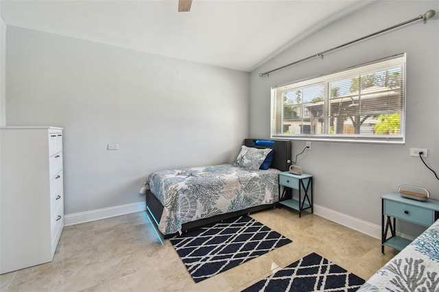 bedroom with baseboards and a ceiling fan