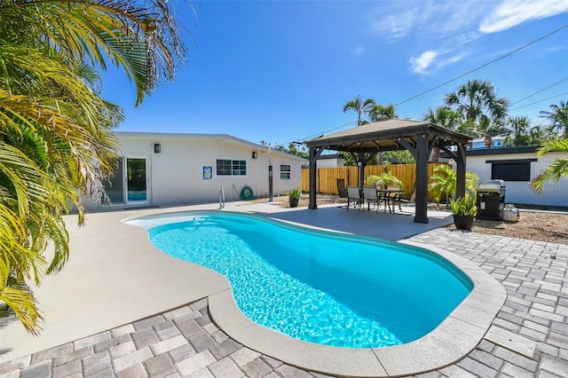 view of pool with a patio, a gazebo, a fenced in pool, and fence
