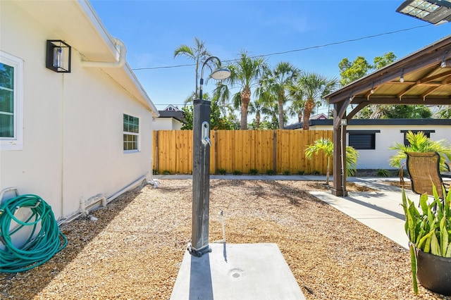 view of yard featuring a patio area and fence