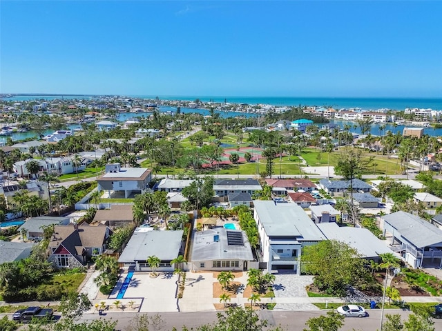 birds eye view of property featuring a water view and a residential view