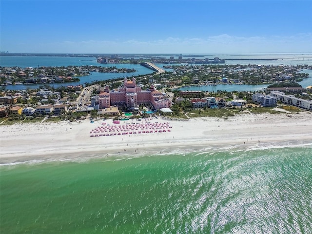 birds eye view of property with a water view and a view of the beach
