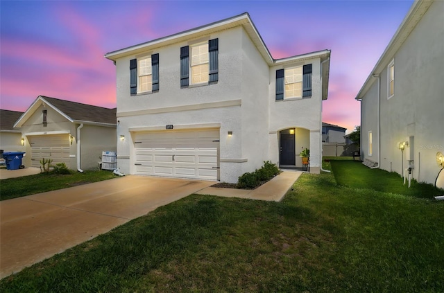 32721 Brooks Hawk Ln, Wesley Chapel, FL 33543 - traditional home featuring a garage, stucco siding, a front yard, and concrete driveway