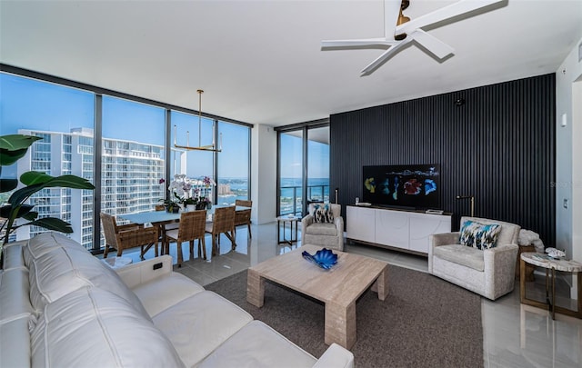 301 1st St S Unit 3004, Saint Petersburg, FL 33701 - tiled living room featuring expansive windows and ceiling fan