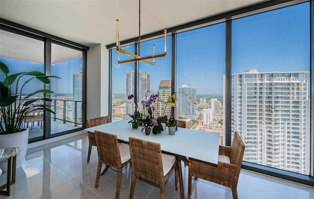301 1st St S Unit 3004, Saint Petersburg, FL 33701 - dining space featuring a wall of windows, an inviting chandelier, a view of city, and a healthy amount of sunlight